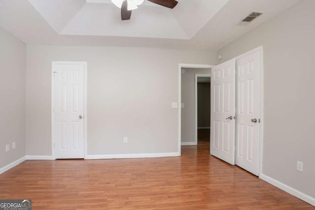 1214 Tyne Way, Stone Mountain, GA 30088 - unfurnished bedroom featuring light wood finished floors, baseboards, and ceiling fan