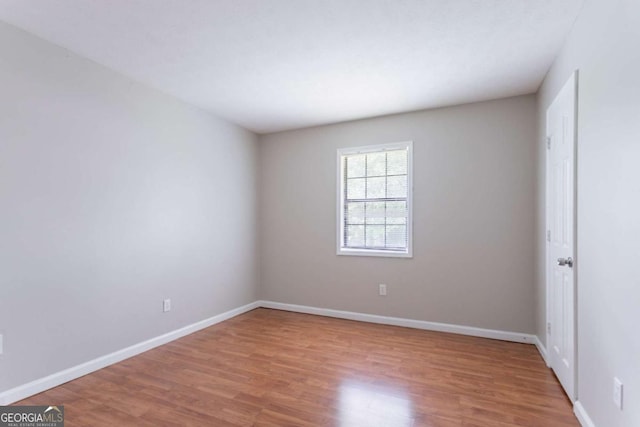1214 Tyne Way, Stone Mountain, GA 30088 - unfurnished room with wood finished floors and baseboards