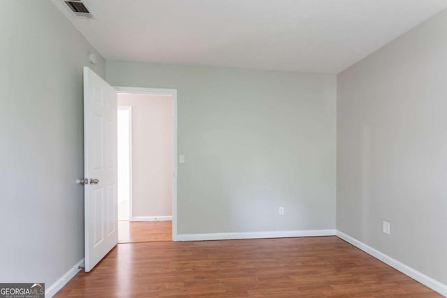 1214 Tyne Way, Stone Mountain, GA 30088 - empty room featuring wood finished floors and baseboards