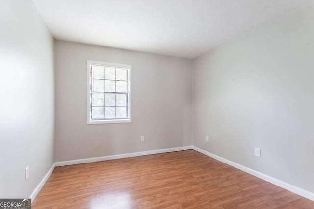 1214 Tyne Way, Stone Mountain, GA 30088 - unfurnished room with light wood-style flooring and baseboards