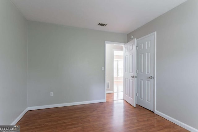 1214 Tyne Way, Stone Mountain, GA 30088 - unfurnished bedroom featuring wood finished floors and baseboards