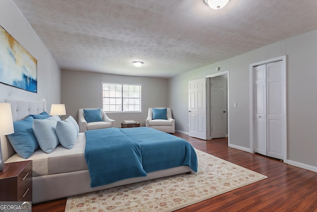 1214 Tyne Way, Stone Mountain, GA 30088 - bedroom with wood finished floors, baseboards, and a textured ceiling