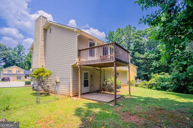 1214 Tyne Way, Stone Mountain, GA 30088 - rear view of property featuring a deck and a chimney