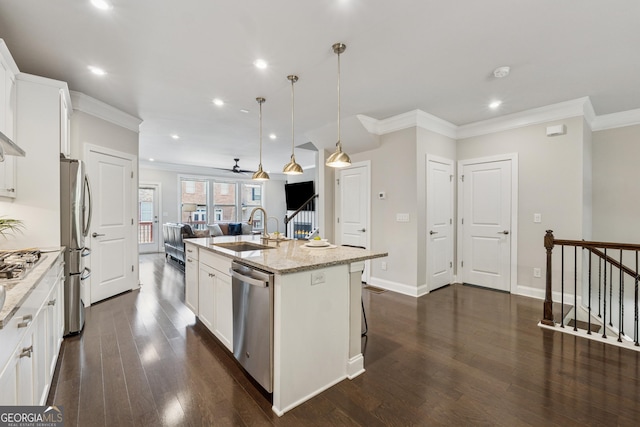 4012 Townsend Ln, Dunwoody, GA 30346 - kitchen featuring appliances with stainless steel finishes, open floor plan, ornamental molding, recessed lighting, and dark wood-type flooring