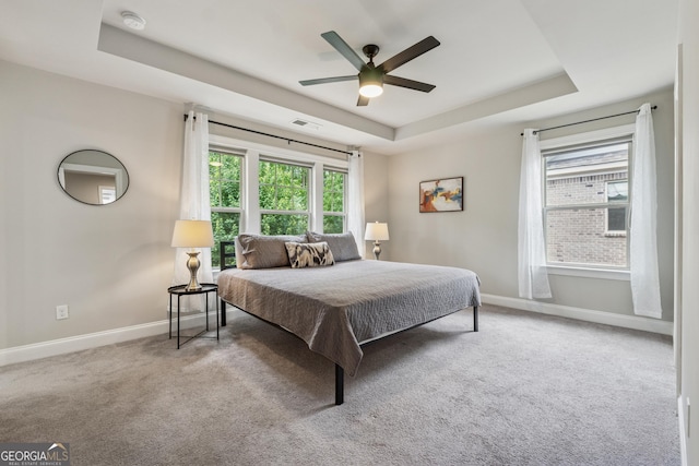4012 Townsend Ln, Dunwoody, GA 30346 - carpeted bedroom with a tray ceiling and ceiling fan