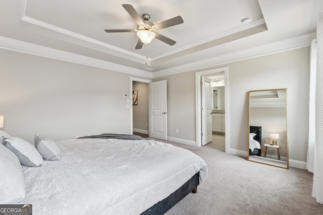 4012 Townsend Ln, Dunwoody, GA 30346 - bedroom featuring a raised ceiling, ornamental molding, light carpet, ceiling fan, and connected bathroom