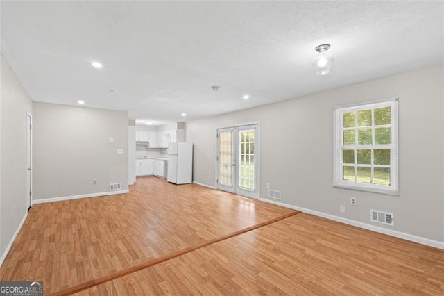 1594 Pine Glen Cir, Decatur, GA 30035 - unfurnished living room featuring light wood-style floors and recessed lighting