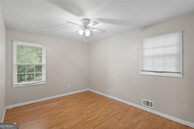 1594 Pine Glen Cir, Decatur, GA 30035 - unfurnished room with a ceiling fan and light wood-style flooring