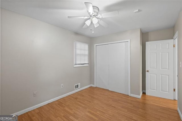 1594 Pine Glen Cir, Decatur, GA 30035 - unfurnished bedroom featuring light wood-style floors, a closet, and a ceiling fan