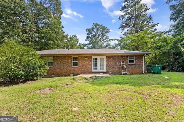 1594 Pine Glen Cir, Decatur, GA 30035 - back of house with french doors, a yard, a patio area, and brick siding