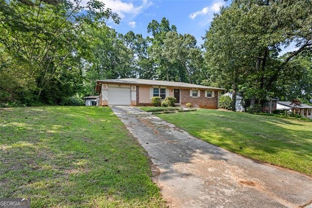 1594 Pine Glen Cir, Decatur, GA 30035 - ranch-style house featuring a front lawn, an attached garage, asphalt driveway, and brick siding