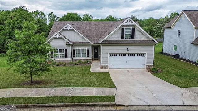 255 Solihull Ln, Athens, GA 30605 - craftsman-style house featuring concrete driveway, board and batten siding, a front lawn, and a shingled roof