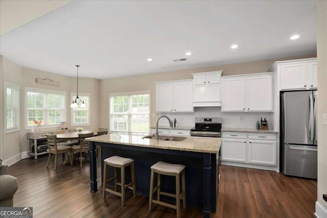 255 Solihull Ln, Athens, GA 30605 - kitchen featuring appliances with stainless steel finishes, plenty of natural light, white cabinetry, and recessed lighting