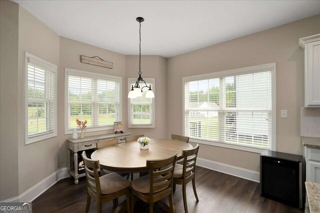 255 Solihull Ln, Athens, GA 30605 - dining room with baseboards, dark wood-style flooring, and a chandelier