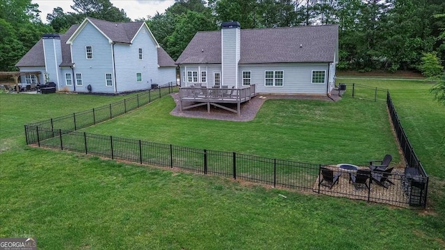 255 Solihull Ln, Athens, GA 30605 - rear view of house with a chimney, a wooden deck, and a fire pit