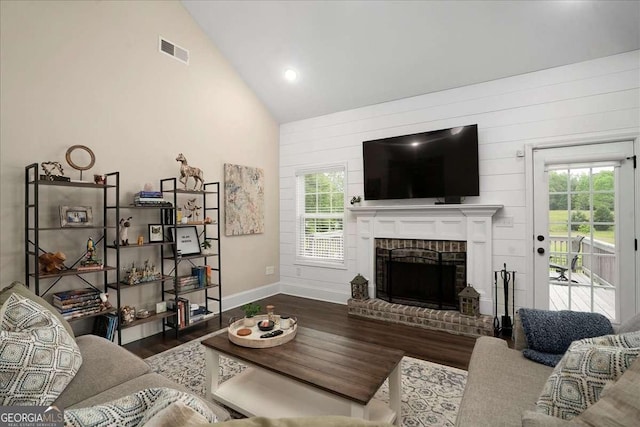255 Solihull Ln, Athens, GA 30605 - living room with wood finished floors, baseboards, a fireplace, plenty of natural light, and high vaulted ceiling