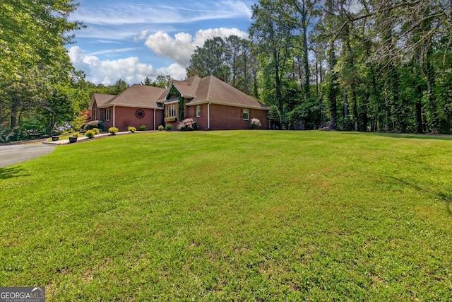 312 Sterling Rd, Jasper, GA 30143 - view of green lawn with asphalt driveway