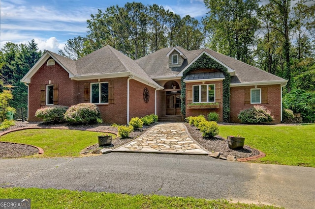 312 Sterling Rd, Jasper, GA 30143 - view of front of property featuring brick siding, a front yard, and roof with shingles