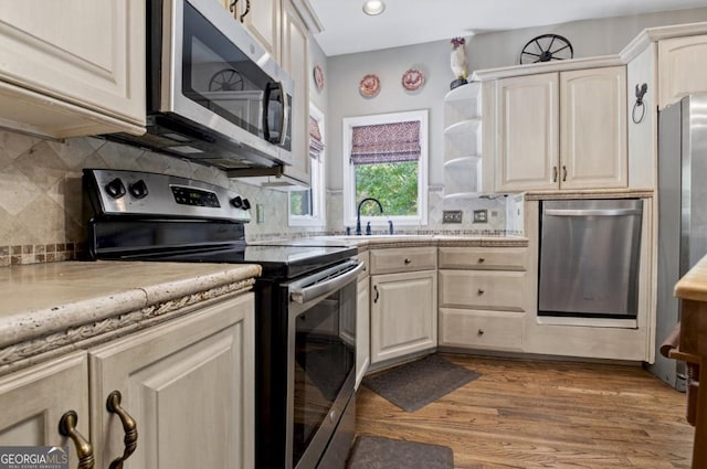 312 Sterling Rd, Jasper, GA 30143 - kitchen featuring appliances with stainless steel finishes, light countertops, wood finished floors, a sink, and recessed lighting