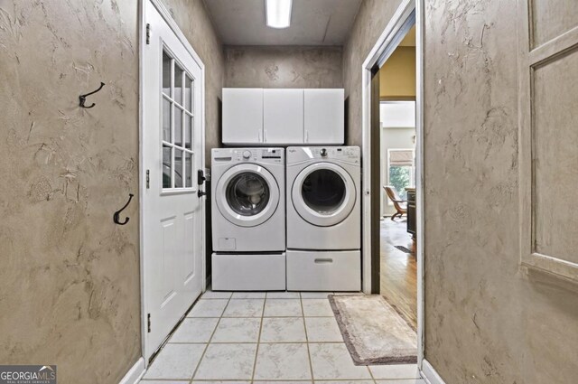 312 Sterling Rd, Jasper, GA 30143 - washroom featuring washer and dryer, cabinet space, and light tile patterned floors