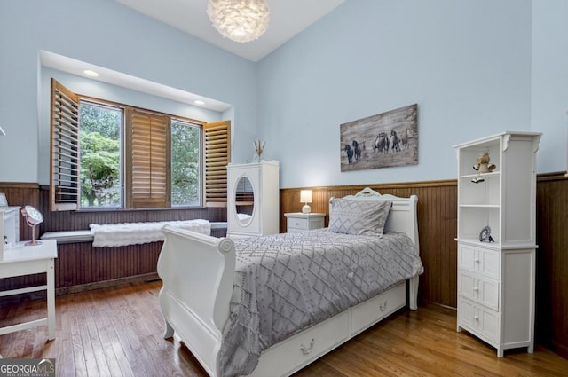 312 Sterling Rd, Jasper, GA 30143 - bedroom featuring a wainscoted wall, wood finished floors, and wooden walls
