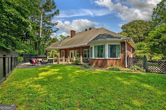 312 Sterling Rd, Jasper, GA 30143 - rear view of house featuring brick siding, a chimney, a patio, and outdoor lounge area
