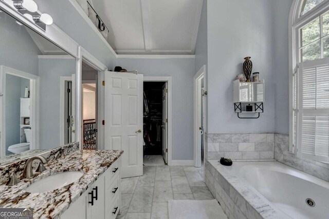 3085 Saint Andrews Dr, Duluth, GA 30096 - bathroom with vanity, a bath, a spacious closet, toilet, and marble finish floors