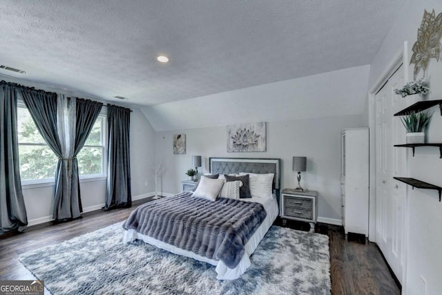 3085 Saint Andrews Dr, Duluth, GA 30096 - bedroom featuring a textured ceiling, vaulted ceiling, baseboards, wood finished floors, and recessed lighting