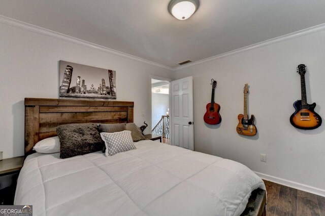 3085 Saint Andrews Dr, Duluth, GA 30096 - bedroom featuring dark wood-style flooring, crown molding, and baseboards