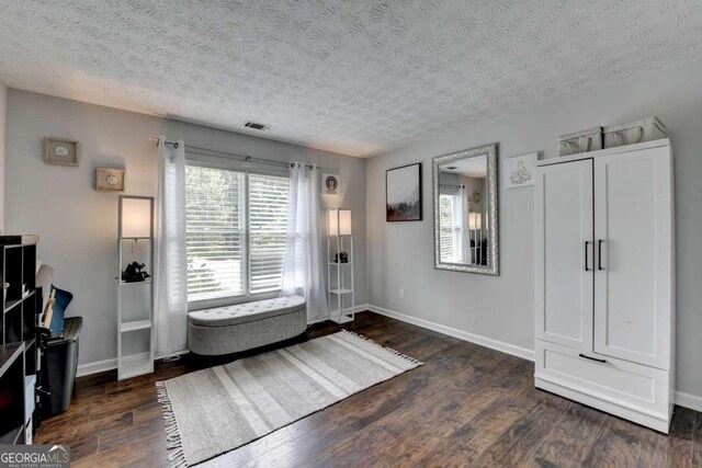 3085 Saint Andrews Dr, Duluth, GA 30096 - entrance foyer with dark wood-style flooring, a textured ceiling, and baseboards
