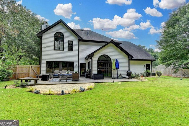 3085 Saint Andrews Dr, Duluth, GA 30096 - back of house with an outdoor living space, a chimney, and a patio area
