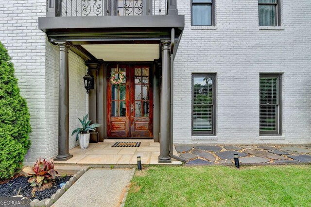3085 Saint Andrews Dr, Duluth, GA 30096 - entrance to property featuring a balcony, brick siding, and french doors