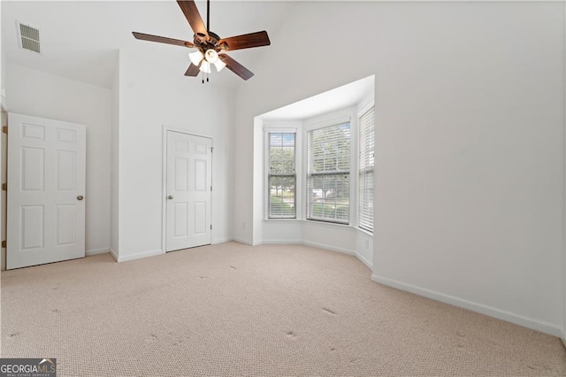 607 Little Shoals Ct, Canton, GA 30115 - unfurnished bedroom with carpet flooring, high vaulted ceiling, and ceiling fan