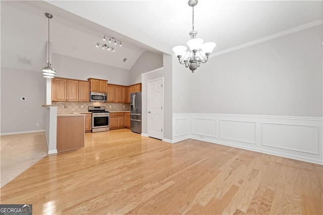 607 Little Shoals Ct, Canton, GA 30115 - kitchen with stainless steel appliances, lofted ceiling, open floor plan, a chandelier, and light countertops