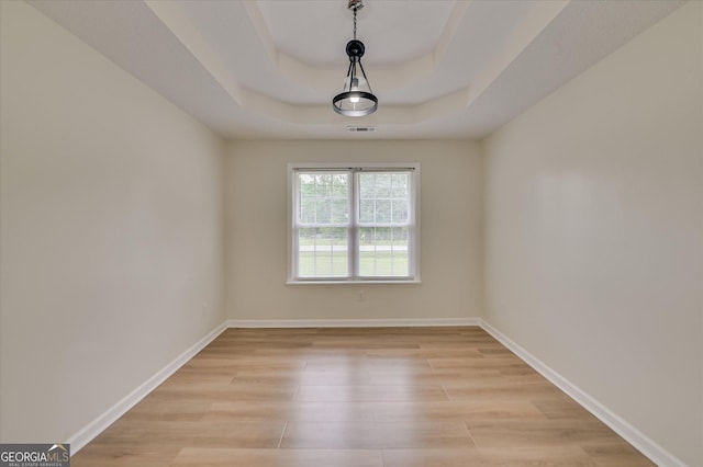 2011 Mims Rd, Hephzibah, GA 30815 - empty room with light wood-type flooring and a raised ceiling
