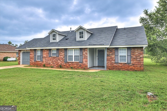 2011 Mims Rd, Hephzibah, GA 30815 - cape cod home with a front yard, brick siding, a garage, and driveway