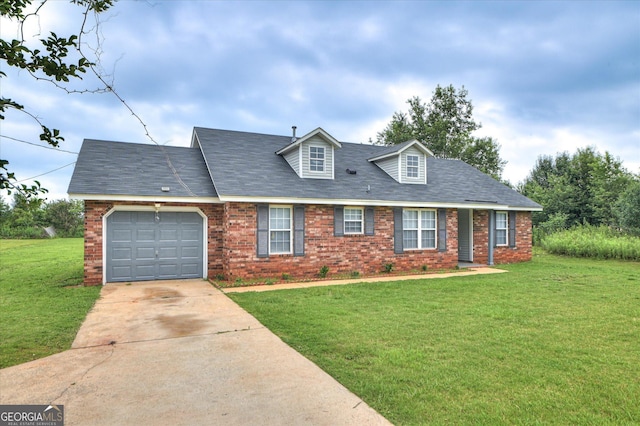 2011 Mims Rd, Hephzibah, GA 30815 - cape cod-style house featuring an attached garage, brick siding, a front yard, and driveway