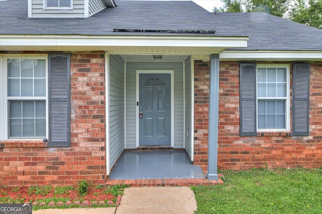 2011 Mims Rd, Hephzibah, GA 30815 - doorway to property featuring brick siding and a shingled roof