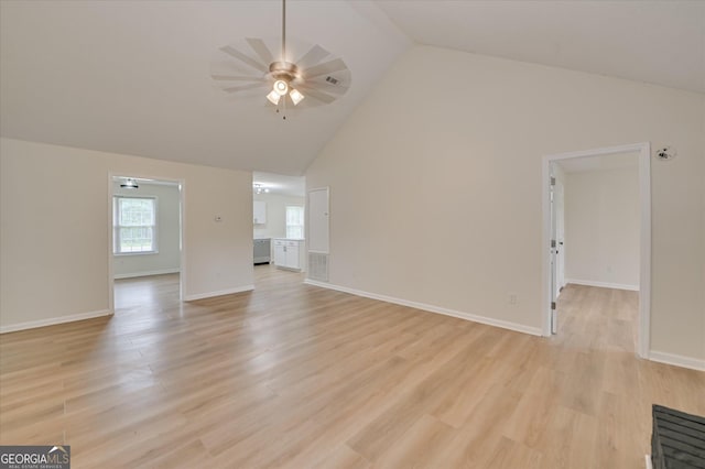 2011 Mims Rd, Hephzibah, GA 30815 - unfurnished living room with a ceiling fan, light wood-style floors, and high vaulted ceiling