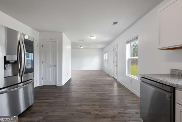 761 Riverside Dr NW, Calhoun, GA 30701 - kitchen with stainless steel appliances, dark wood finished floors, open floor plan, and white cabinetry