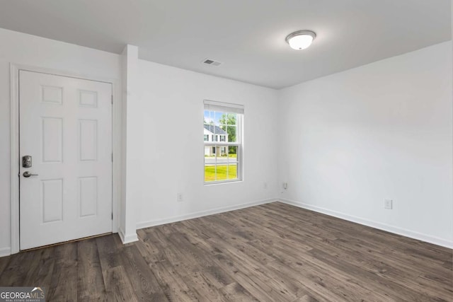 761 Riverside Dr NW, Calhoun, GA 30701 - empty room featuring dark wood-type flooring