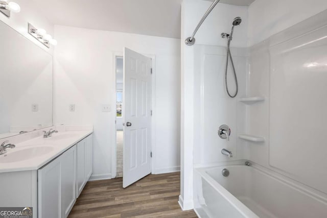 761 Riverside Dr NW, Calhoun, GA 30701 - bathroom with bathing tub / shower combination, wood finished floors, and double vanity