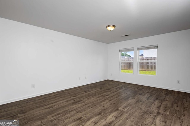 761 Riverside Dr NW, Calhoun, GA 30701 - empty room featuring dark wood-style floors and baseboards