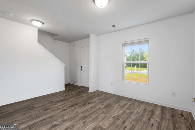 761 Riverside Dr NW, Calhoun, GA 30701 - unfurnished room with wood finished floors, a smoke detector, and stairway