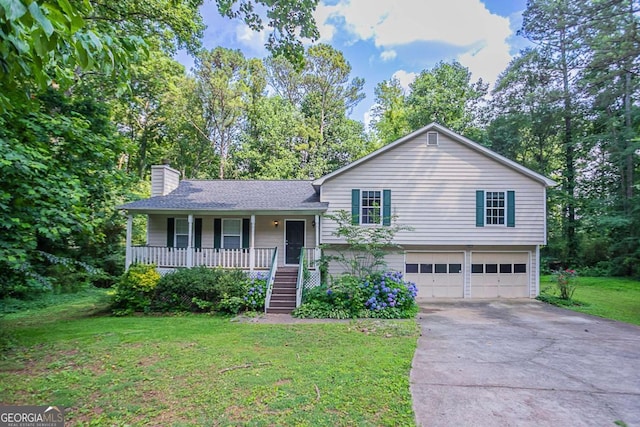 2140 Deer Trl, Suwanee, GA 30024 - tri-level home featuring covered porch, an attached garage, a chimney, driveway, and a front yard