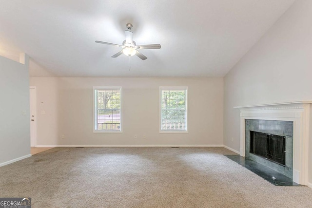 2140 Deer Trl, Suwanee, GA 30024 - unfurnished living room with a ceiling fan, carpet, a fireplace with flush hearth, baseboards, and vaulted ceiling