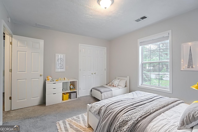 2140 Deer Trl, Suwanee, GA 30024 - carpeted bedroom featuring a closet