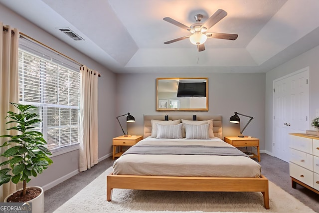 2140 Deer Trl, Suwanee, GA 30024 - bedroom with a tray ceiling, light colored carpet, and multiple windows