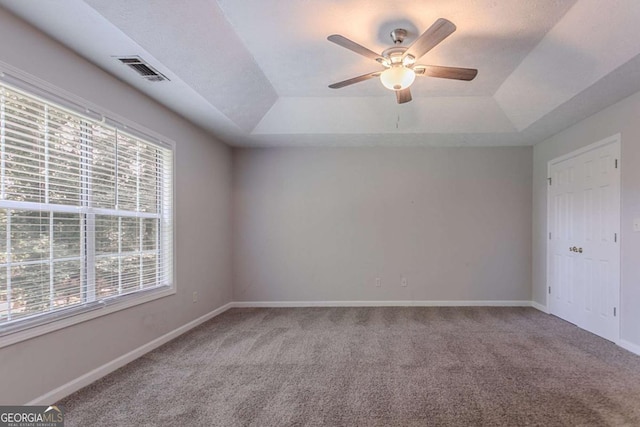2140 Deer Trl, Suwanee, GA 30024 - carpeted empty room with a tray ceiling, ceiling fan, and baseboards