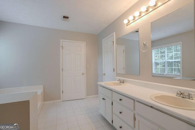 2140 Deer Trl, Suwanee, GA 30024 - full bath with double vanity, tile patterned floors, a garden tub, and baseboards
